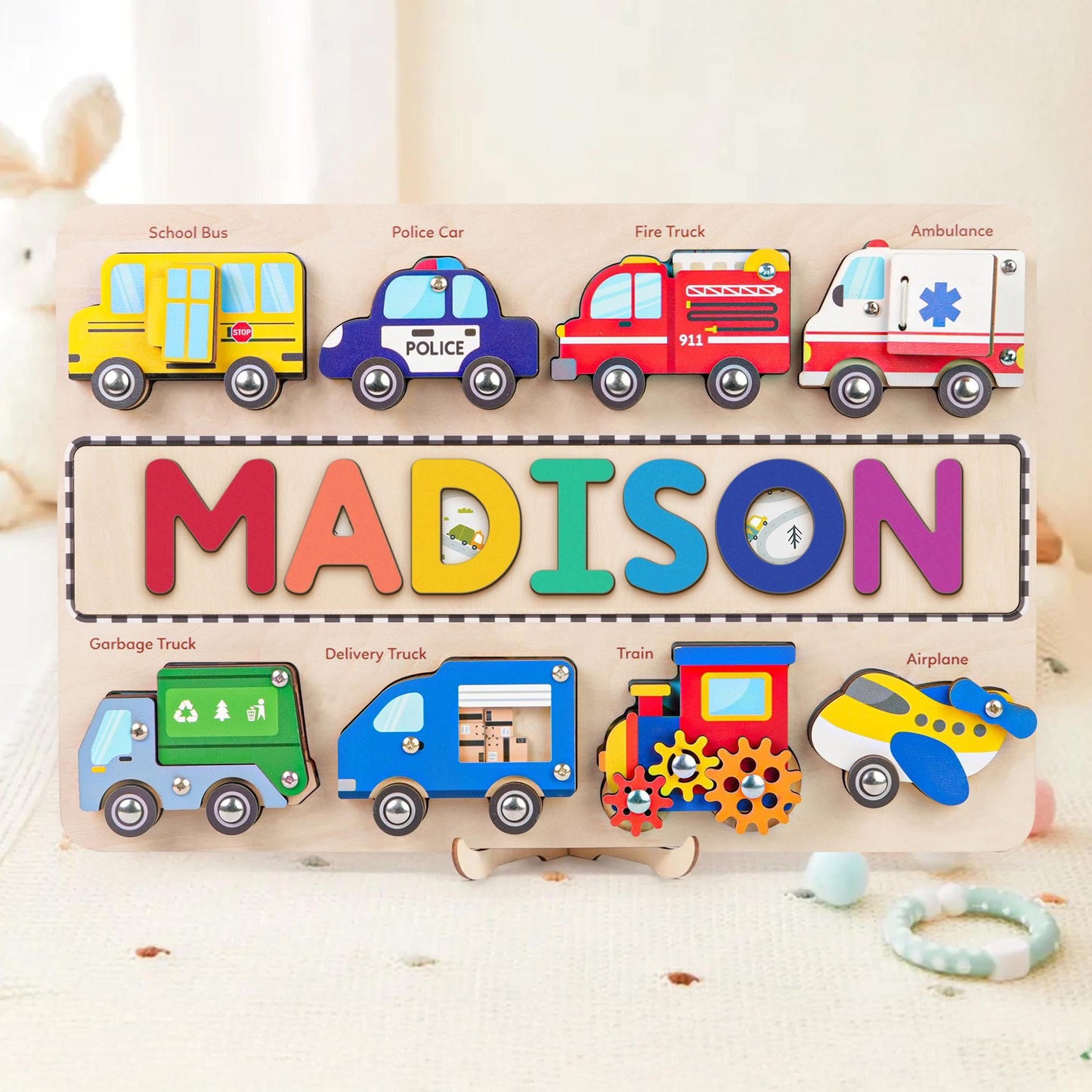 Personalized wooden name puzzle with colorful vehicles and letters for kids learning and play.