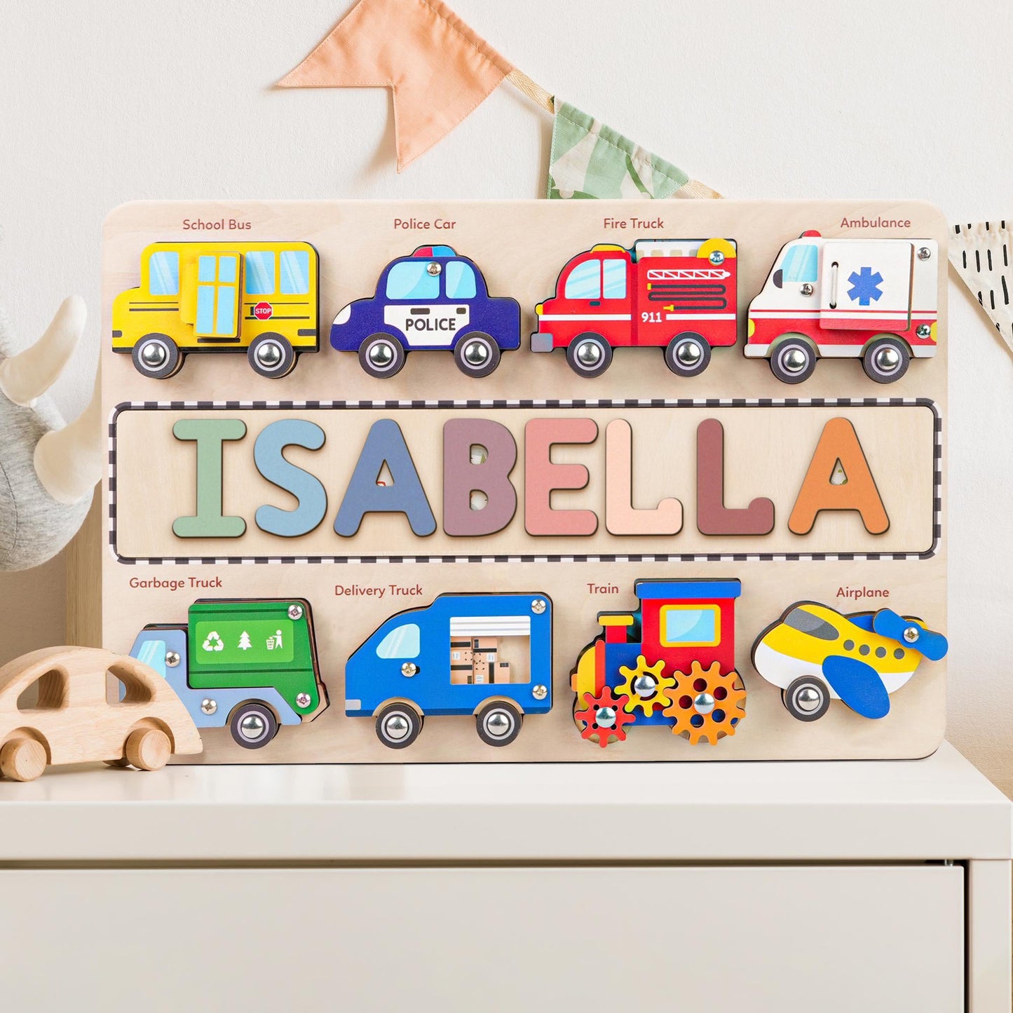 Personalized wooden traffic name puzzle featuring colorful vehicle themes and letters for child engagement.