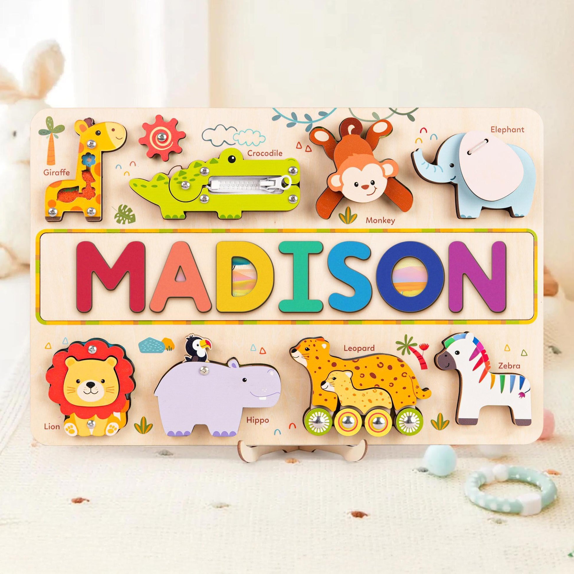 Personalized wooden animal name puzzle busy board for children featuring vibrant animal designs and colorful letters.