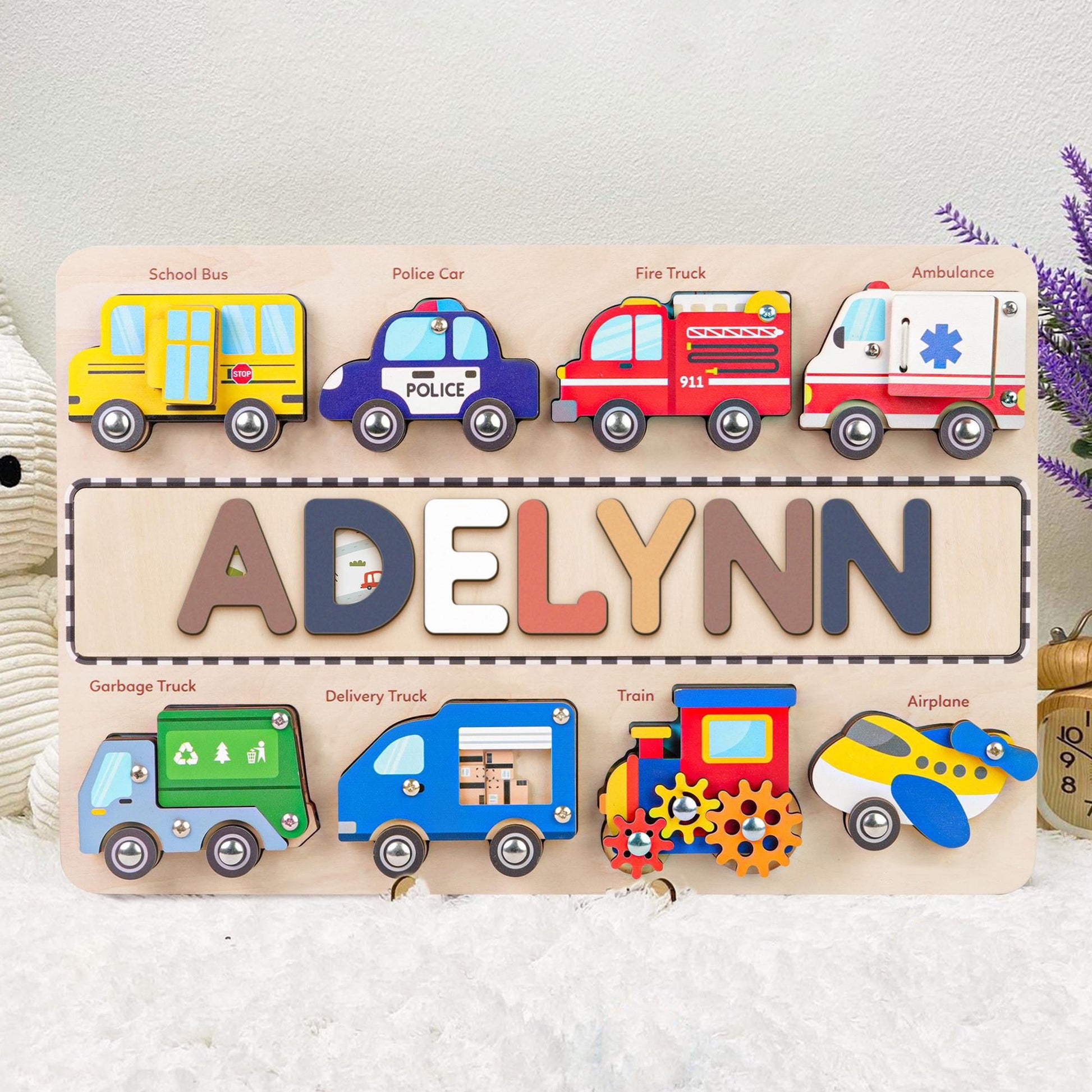 Colorful personalized wooden name puzzle featuring vehicles and the name 'Adelynn' for educational play.