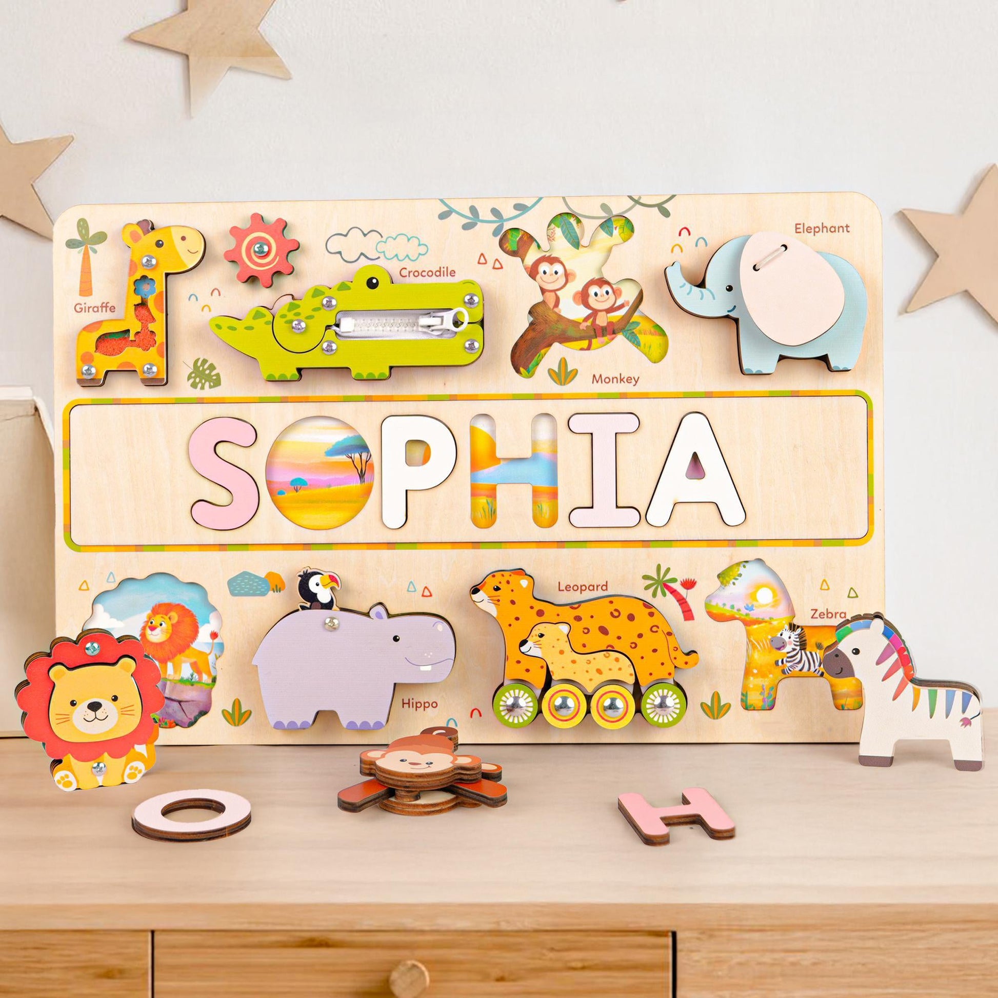 Personalized wooden animal name puzzle busy board featuring colorful animal shapes and the name 'SOPHIA'.