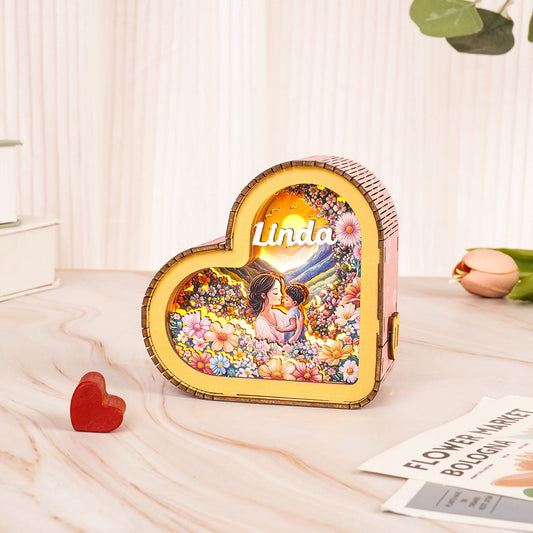 Personalized 3D wooden puzzle night light in heart shape with floral design and custom name 'Linda'.