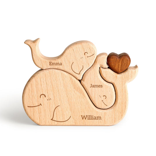 Personalized wooden whale family puzzle featuring names Emma, James, and William, perfect for home decor and gifts.