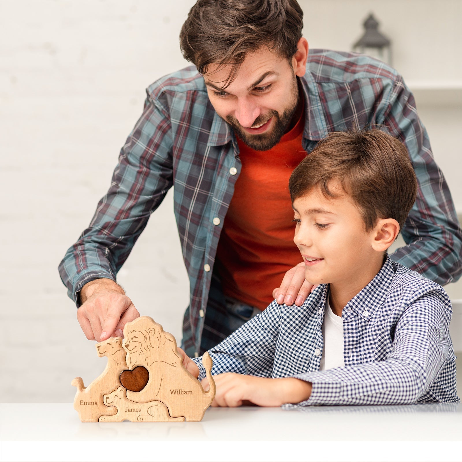 Father and son assembling a personalized wooden lion family puzzle, showcasing love and togetherness.