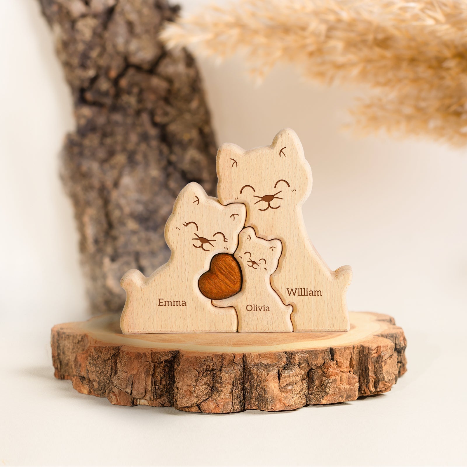 Personalized wooden cat family puzzle decor featuring names Emma, Olivia, and William, symbolizing family love.
