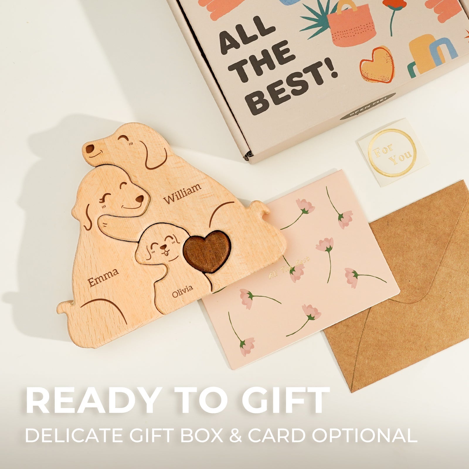 Personalized wooden dog family puzzle with names Emma, William, and Olivia, ready for gifting in a delicate box.