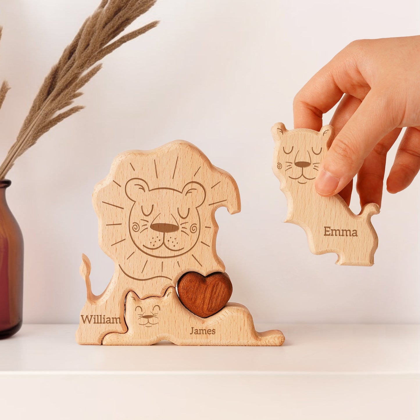 Personalized wooden lion family puzzle showing engraved names William and Emma, a thoughtful decor piece.