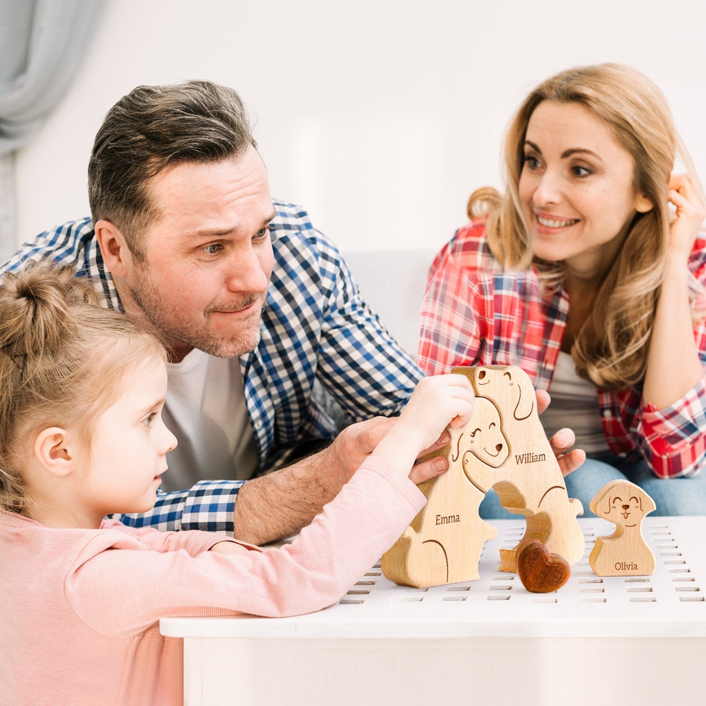 Family enjoying personalized wooden dog puzzle together, showcasing names and a joyful moment of togetherness.