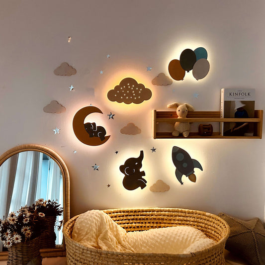 Wooden Baby's Room Wall Light Set featuring elephants, clouds, and stars, creating a calming bedtime atmosphere.