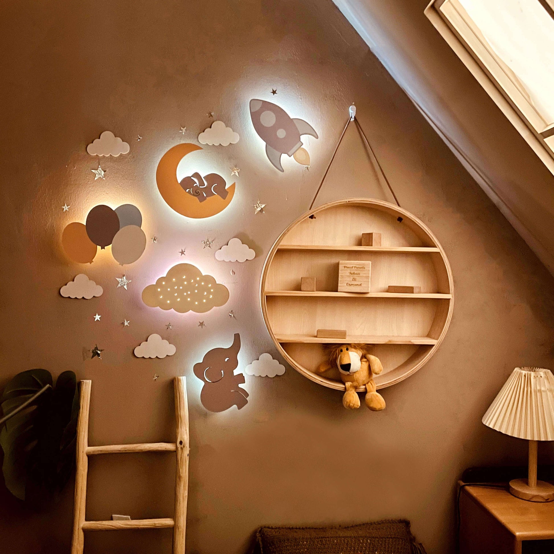 Wooden baby's room wall light set featuring dreamy designs with a sleeping elephant, moon, and rocket decor.