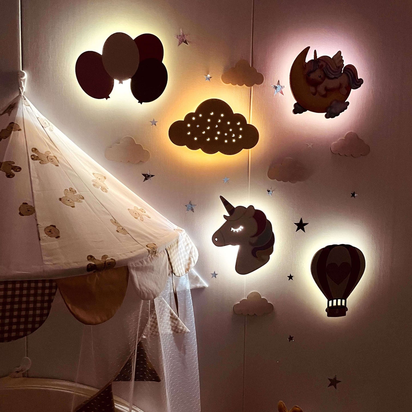Wooden baby room wall light set featuring unicorn, balloons, clouds, and hot air balloon designs, creating a dreamy atmosphere.